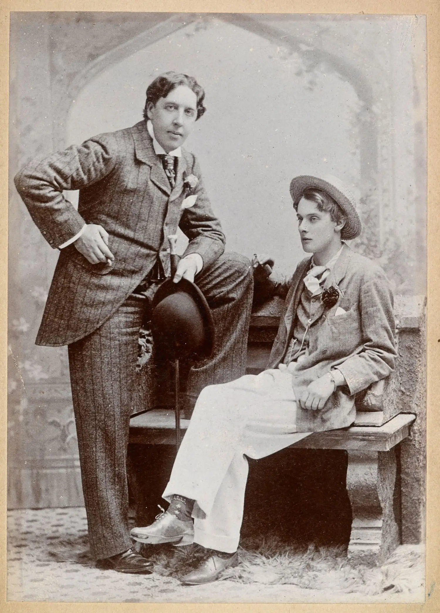 A studio photograph of Oscar Wilde and Lord Alfred Douglas.